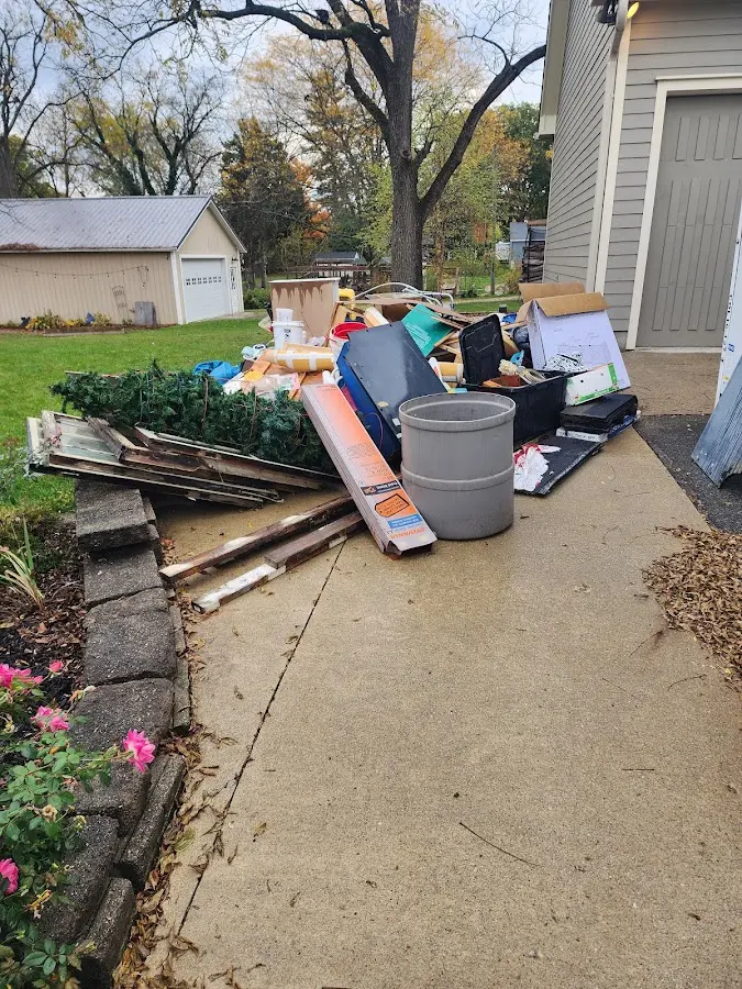 Dumpster being loaded with debris for Commercial Dumpster Rental in Woodway
